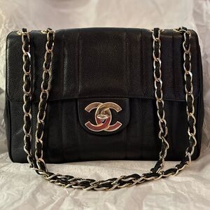 Chanel Vintage Jumbo Flap Bag crafted in black vertical stitch caviar leather